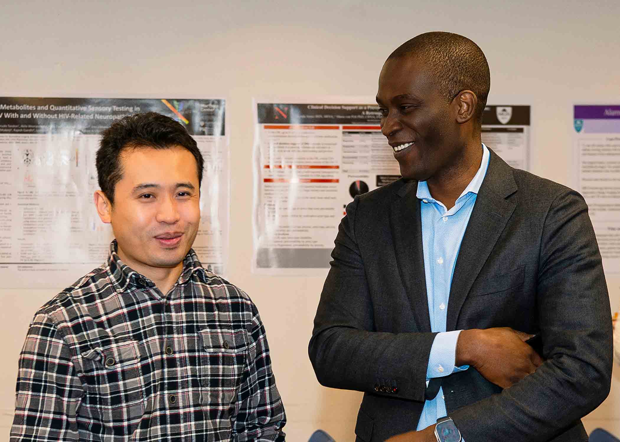 Dr. Li at DACCPM Research Night 2023 with department chair Dr. Seun Johnson-Akeju.